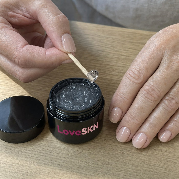 A pea of jelly glue lifted from the LoveSKN jar on the wooden stick